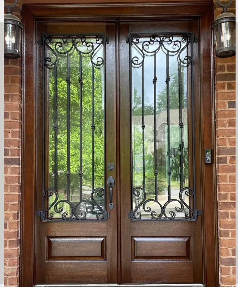 Iron and wood double entry door after refinishing in Washington DC
